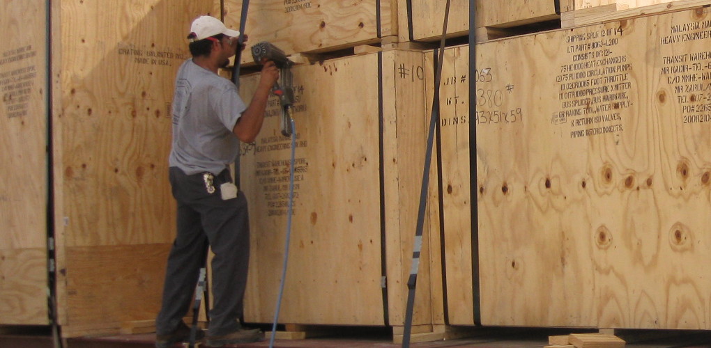 CCI Employee crating up a container with nailgun